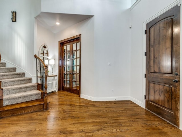 1141 Saint Peter Ln, Prosper, TX 75078 - entrance foyer featuring french doors, wood finished floors, and stairway