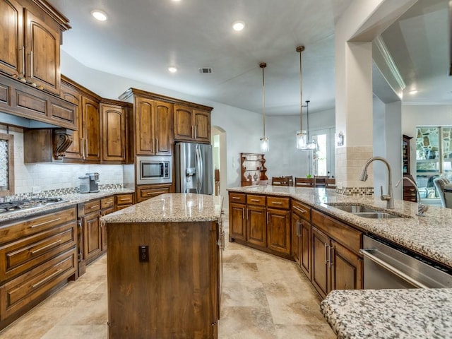 1141 Saint Peter Ln, Prosper, TX 75078 - kitchen featuring stainless steel appliances, tasteful backsplash, light stone counters, healthy amount of natural light, and recessed lighting