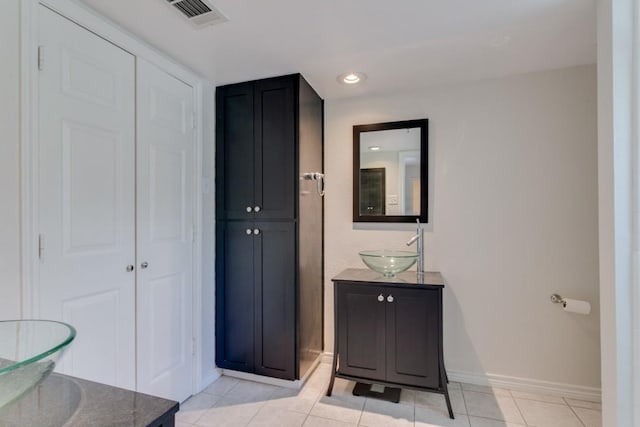 3100 Cole Ave Unit 203, Dallas, TX 75204 - bathroom with baseboards, vanity, tile patterned flooring, and recessed lighting