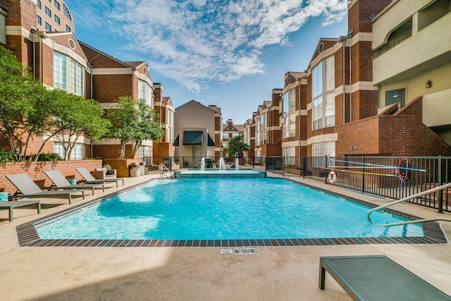 3100 Cole Ave Unit 203, Dallas, TX 75204 - community pool featuring a residential view, fence, and a patio area