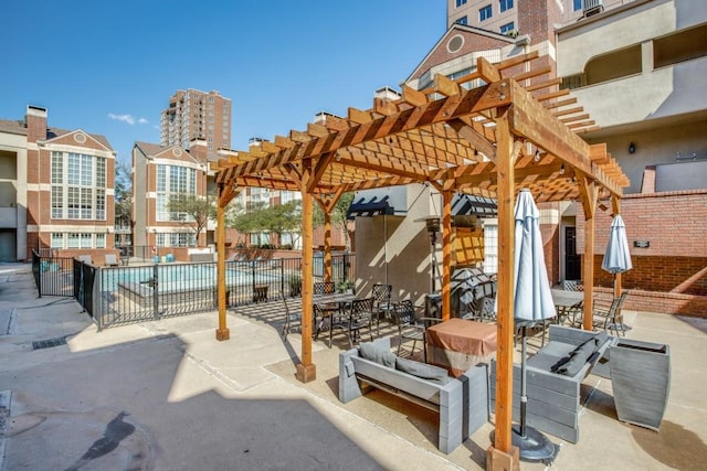 3100 Cole Ave Unit 203, Dallas, TX 75204 - view of patio featuring a pergola, fence, and a community pool