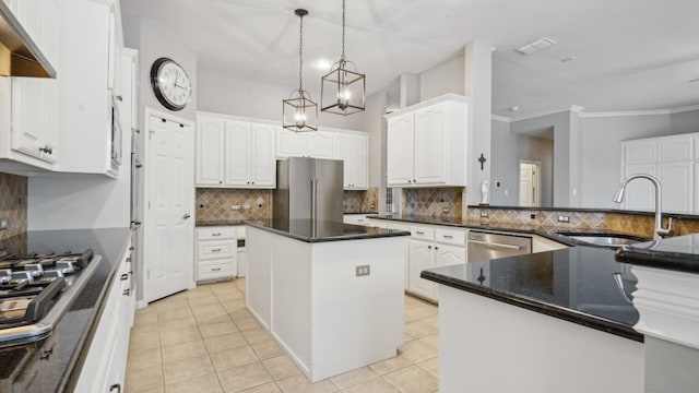 6000 Windridge Ln, Flower Mound, TX 75028 - kitchen with stainless steel appliances, a sink, light tile patterned flooring, tasteful backsplash, and white cabinets