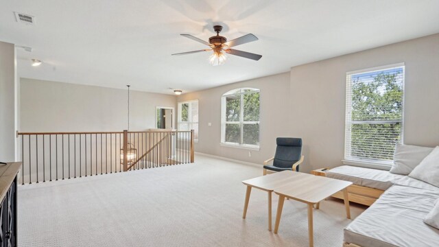 6000 Windridge Ln, Flower Mound, TX 75028 - carpeted living room featuring plenty of natural light, ceiling fan, and baseboards