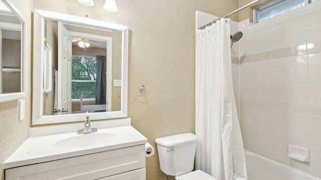 6000 Windridge Ln, Flower Mound, TX 75028 - full bath featuring toilet, a textured wall, vanity, shower / tub combo, and ceiling fan