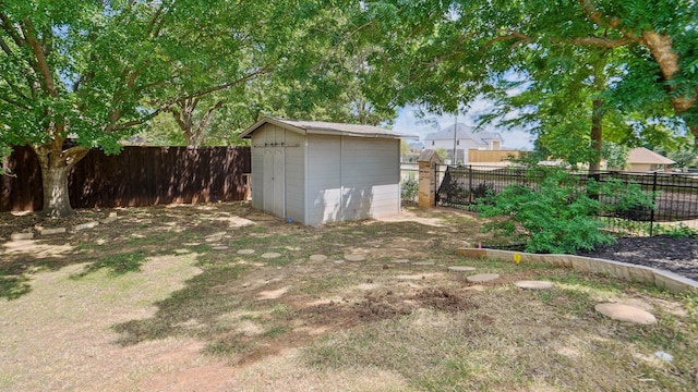 6000 Windridge Ln, Flower Mound, TX 75028 - fenced backyard with a storage unit and an outbuilding