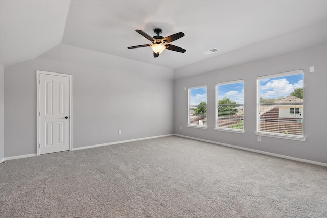 6600 Stewart Blvd, The Colony, TX 75056 - carpeted empty room featuring a ceiling fan, baseboards, and vaulted ceiling