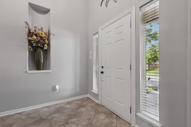 6600 Stewart Blvd, The Colony, TX 75056 - foyer entrance featuring light tile patterned floors and baseboards