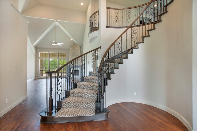 188 Las Colinas Trl, Cross Roads, TX 76227 - staircase featuring wood finished floors, a ceiling fan, baseboards, and high vaulted ceiling