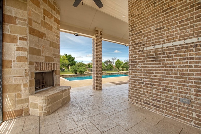 188 Las Colinas Trl, Cross Roads, TX 76227 - view of patio with an outdoor stone fireplace, a ceiling fan, and an outdoor pool