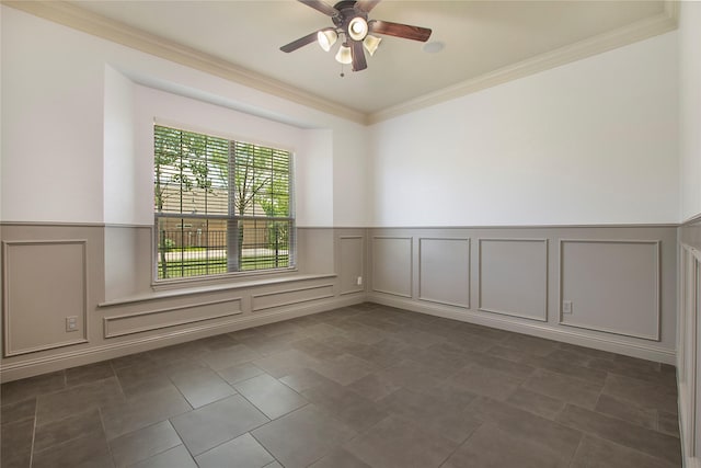 188 Las Colinas Trl, Cross Roads, TX 76227 - empty room with a decorative wall, a wainscoted wall, ornamental molding, ceiling fan, and dark tile patterned floors