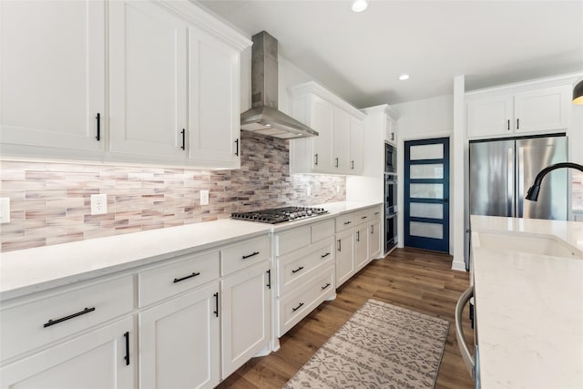 959 County Road 1300, Bridgeport, TX 76426 - kitchen featuring wall chimney exhaust hood, stainless steel appliances, white cabinets, backsplash, and a sink