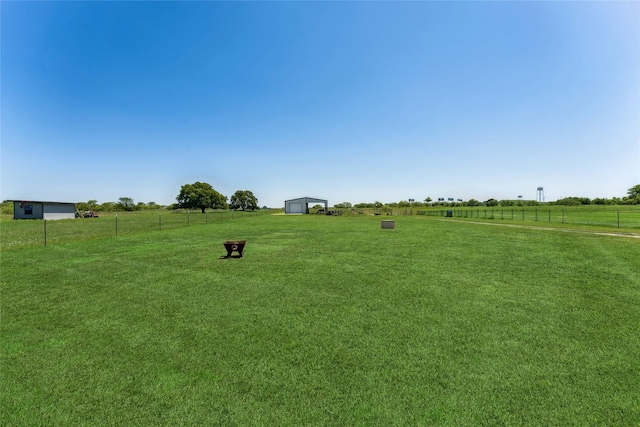 959 County Road 1300, Bridgeport, TX 76426 - view of yard featuring a detached garage and a view of rural / pastoral area