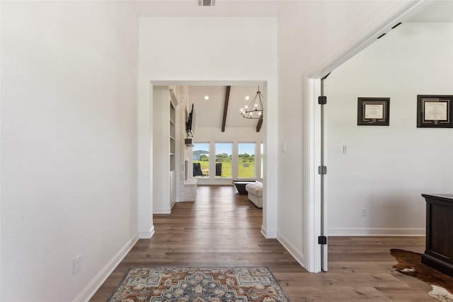 959 County Road 1300, Bridgeport, TX 76426 - corridor with wood finished floors, baseboards, a chandelier, and beamed ceiling