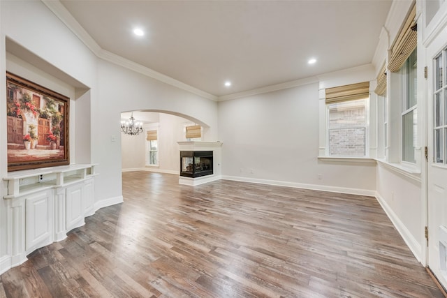 2132 Portwood Way, Fort Worth, TX 76179 - unfurnished living room featuring ornamental molding, a chandelier, wood finished floors, a multi sided fireplace, and recessed lighting