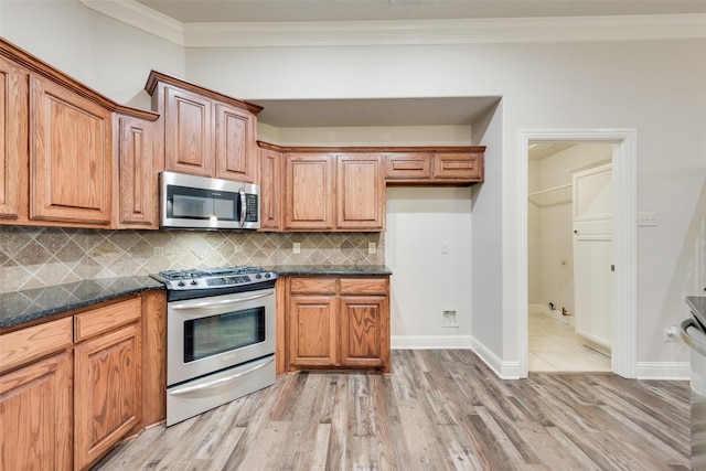2132 Portwood Way, Fort Worth, TX 76179 - kitchen with stainless steel appliances, light wood-type flooring, backsplash, ornamental molding, and brown cabinetry