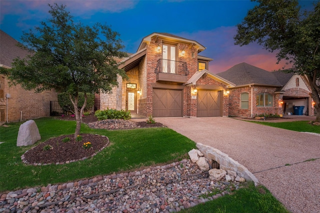 2132 Portwood Way, Fort Worth, TX 76179 - view of front of property with a balcony, driveway, an attached garage, brick siding, and a yard