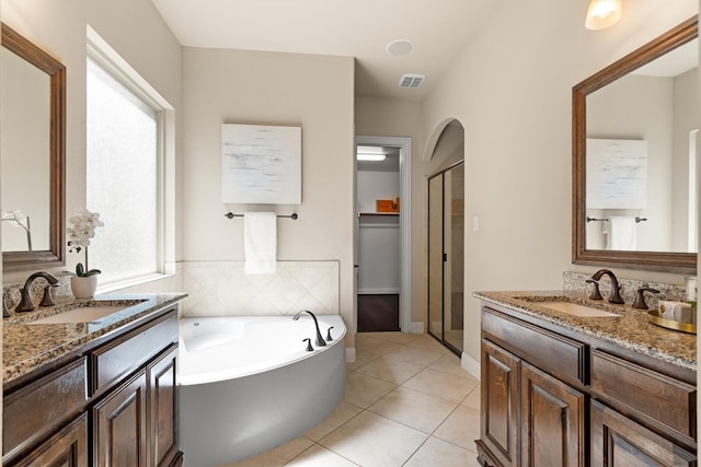 2886 Nottingham Dr, Trophy Club, TX 76262 - full bathroom with tile patterned flooring, a shower stall, a garden tub, and two vanities