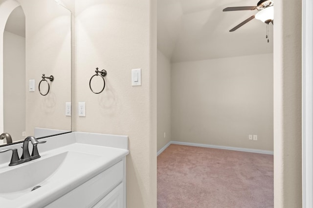 2886 Nottingham Dr, Trophy Club, TX 76262 - bathroom featuring ceiling fan, vanity, vaulted ceiling, and baseboards