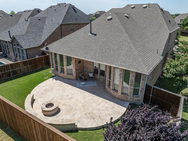 2886 Nottingham Dr, Trophy Club, TX 76262 - rear view of house featuring a patio area, brick siding, a shingled roof, and an outdoor fire pit