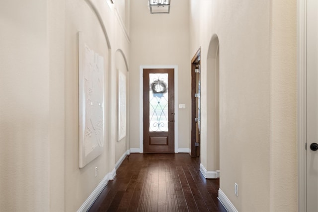 2886 Nottingham Dr, Trophy Club, TX 76262 - foyer entrance with dark wood-style floors, baseboards, and a towering ceiling