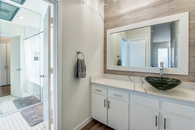 3907 Throckmorton St Unit 4, Dallas, TX 75219 - bathroom with vanity, baseboards, and shower / bathtub combination