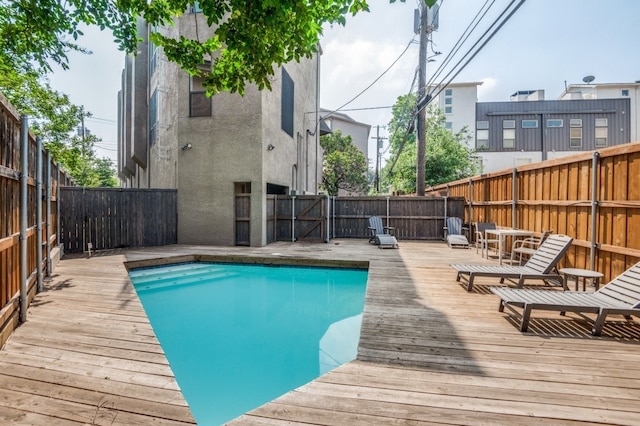 3907 Throckmorton St Unit 4, Dallas, TX 75219 - view of pool with a fenced backyard and a deck
