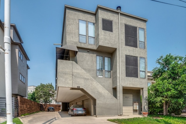3907 Throckmorton St Unit 4, Dallas, TX 75219 - view of front of home featuring stucco siding and fence
