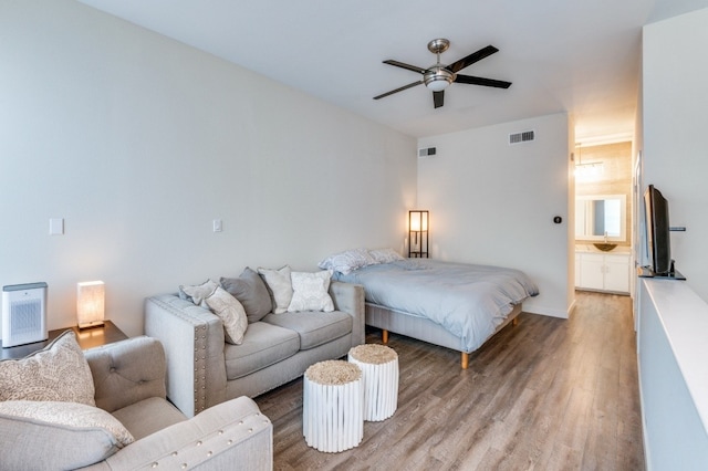 3907 Throckmorton St Unit 4, Dallas, TX 75219 - bedroom featuring light wood-style flooring and a ceiling fan