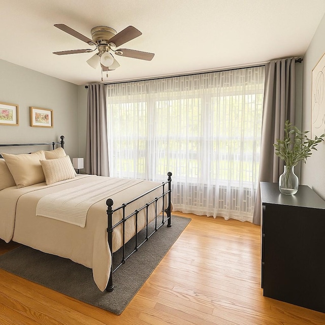 3124 Crest Ridge Dr, Dallas, TX 75228 - bedroom with light wood-type flooring and a ceiling fan