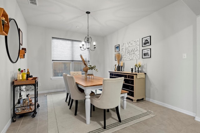 501 Bird Creek Dr, Little Elm, TX 75068 - dining room featuring a chandelier, light tile patterned flooring, and baseboards