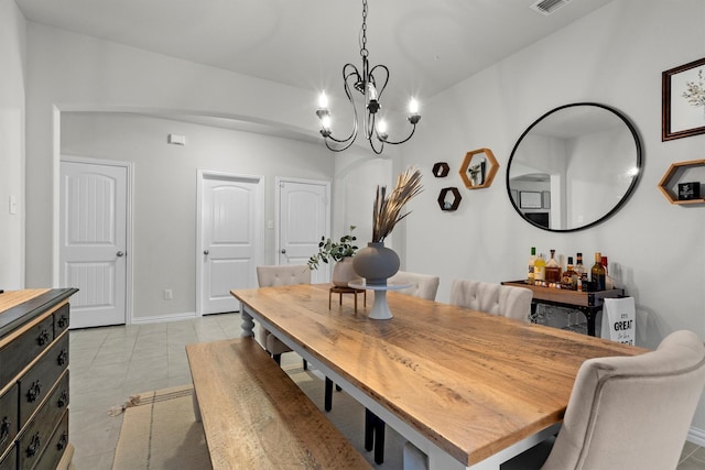 501 Bird Creek Dr, Little Elm, TX 75068 - dining area featuring a chandelier, light tile patterned flooring, and baseboards