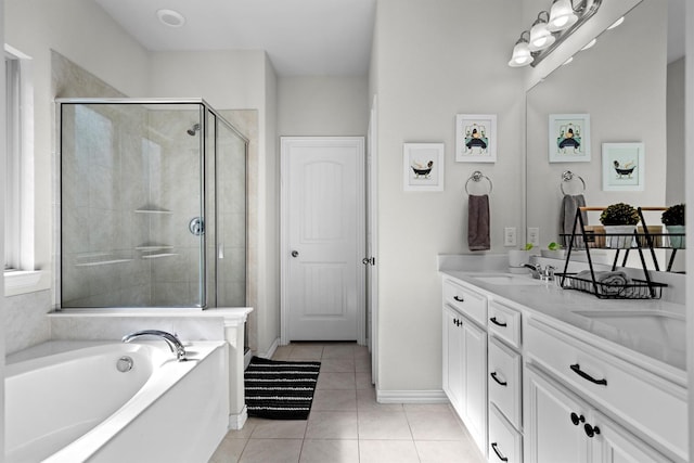 501 Bird Creek Dr, Little Elm, TX 75068 - full bath with a stall shower, tile patterned flooring, a bath, double vanity, and baseboards