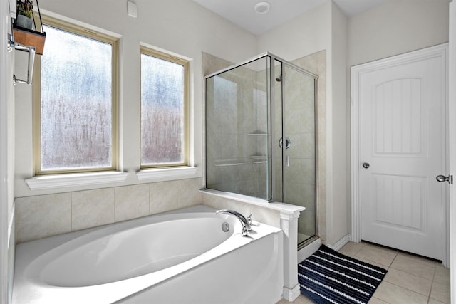501 Bird Creek Dr, Little Elm, TX 75068 - bathroom with a stall shower, a bath, and tile patterned floors