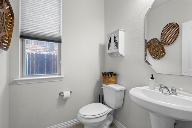 501 Bird Creek Dr, Little Elm, TX 75068 - half bath featuring toilet, a sink, and baseboards