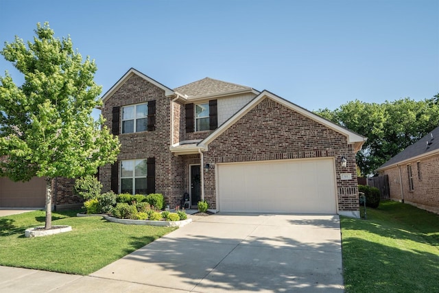 501 Bird Creek Dr, Little Elm, TX 75068 - traditional-style home featuring driveway, an attached garage, and brick siding