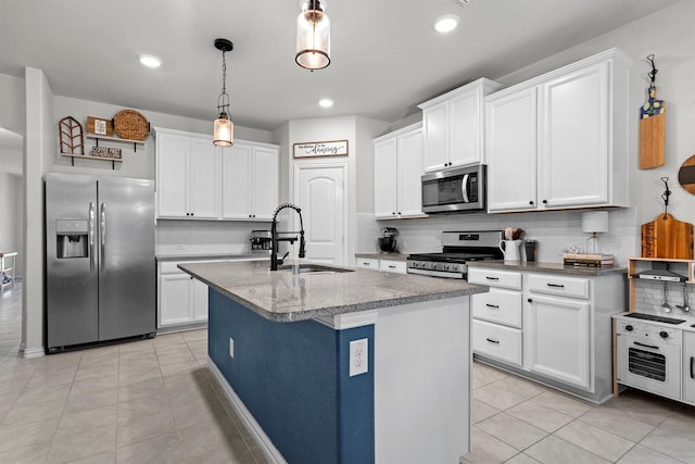 501 Bird Creek Dr, Little Elm, TX 75068 - kitchen with appliances with stainless steel finishes, a sink, decorative backsplash, light tile patterned floors, and recessed lighting