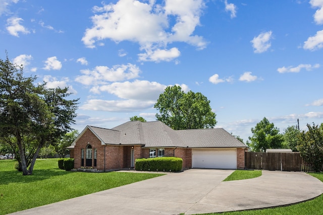 view of front of house featuring brick siding, driveway, an attached garage, and roof with shingles