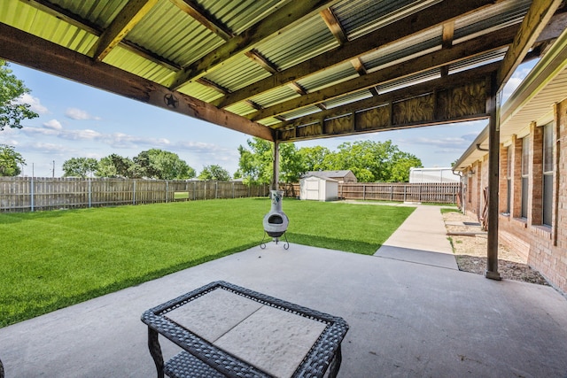 view of patio / terrace with a shed and an outdoor structure