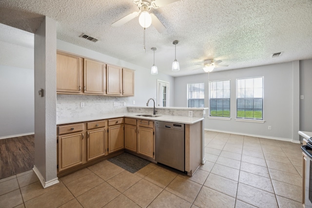 kitchen with dishwasher, ceiling fan, a peninsula, light countertops, and a textured ceiling
