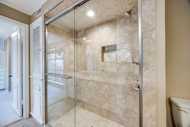 6070 Averill Way Unit A, Dallas, TX 75225 - bathroom featuring toilet, a shower stall, and crown molding