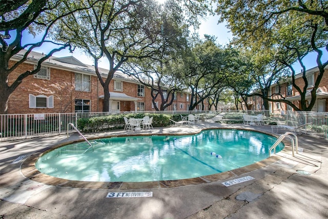 6070 Averill Way Unit A, Dallas, TX 75225 - community pool featuring a patio area