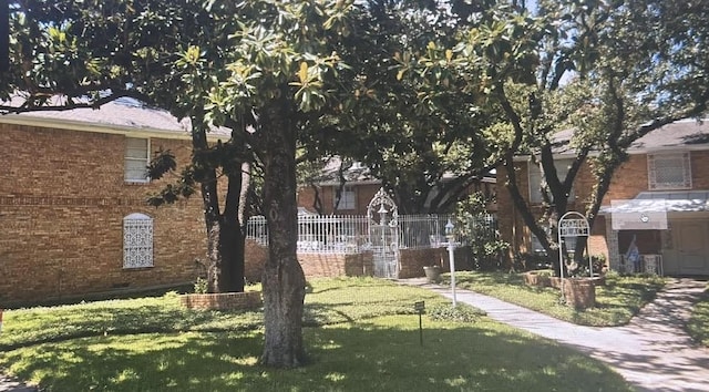 6070 Averill Way Unit A, Dallas, TX 75225 - view of front of home featuring brick siding
