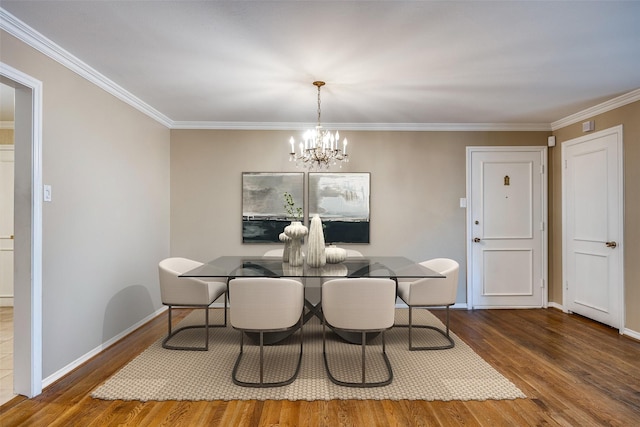 6070 Averill Way Unit A, Dallas, TX 75225 - dining room featuring a chandelier, wood finished floors, crown molding, and baseboards