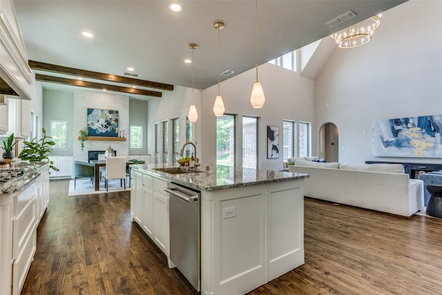 2205 Grafton Ln, Mckinney, TX 75071 - kitchen with a sink, dishwasher, open floor plan, a fireplace, and beam ceiling