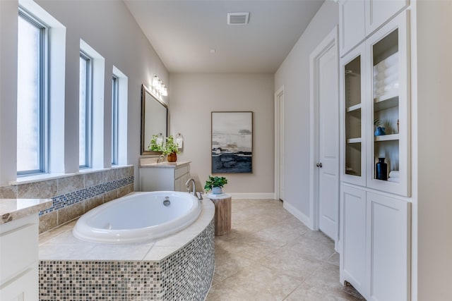 2205 Grafton Ln, Mckinney, TX 75071 - full bath featuring vanity, a bath, and tile patterned floors