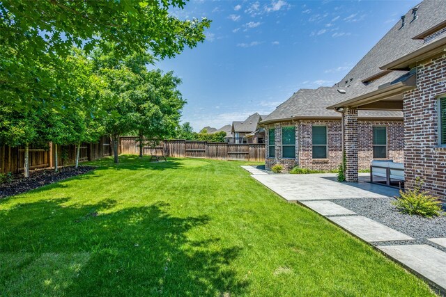 2205 Grafton Ln, Mckinney, TX 75071 - view of yard featuring a patio area