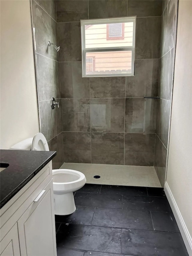 2603 Pine St, Dallas, TX 75215 - bathroom featuring a stall shower, toilet, vanity, and baseboards