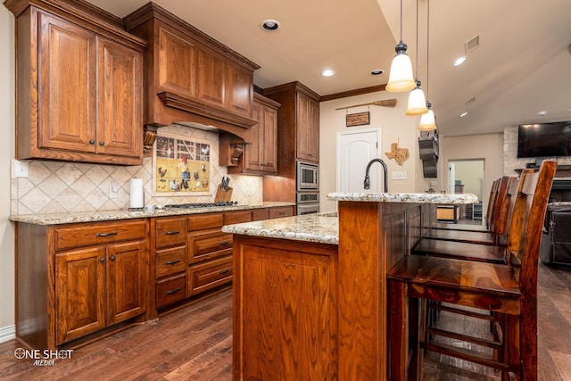 4549 Coyote Run, Abilene, TX 79602 - kitchen featuring stainless steel appliances, dark wood-style floors, light stone counters, decorative backsplash, and recessed lighting