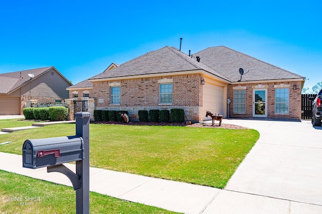 4549 Coyote Run, Abilene, TX 79602 - french country inspired facade featuring brick siding, a garage, roof with shingles, and driveway