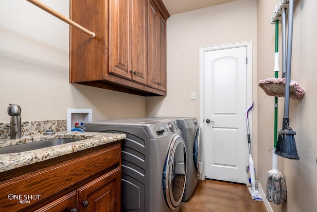 4549 Coyote Run, Abilene, TX 79602 - laundry area featuring cabinet space and washing machine and dryer